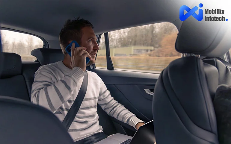 a man sitting a car and talking by smart phone