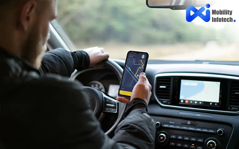 A man driving car with hold phone and see map